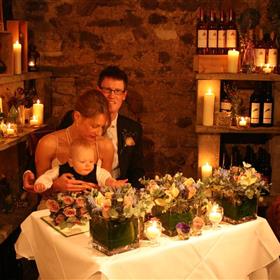 fwthumbRegistar's table at The Angel at Hetton's Wine Cave. Cubes of flowers & hundreds of candles..jpg